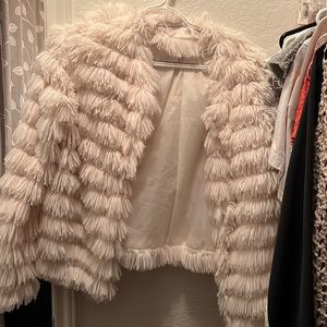 The impeccable pig fluffy white jacket